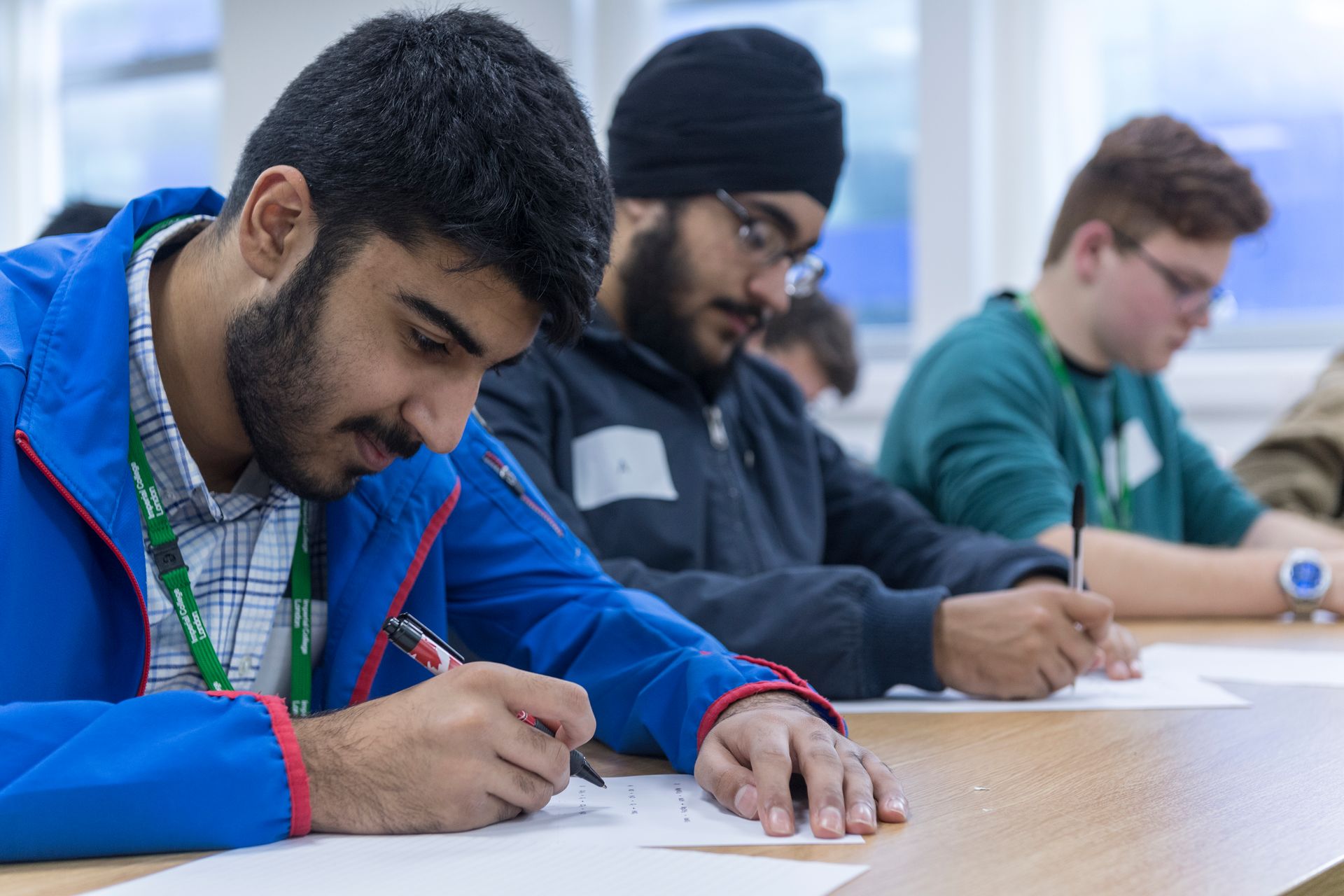 Young men studying together