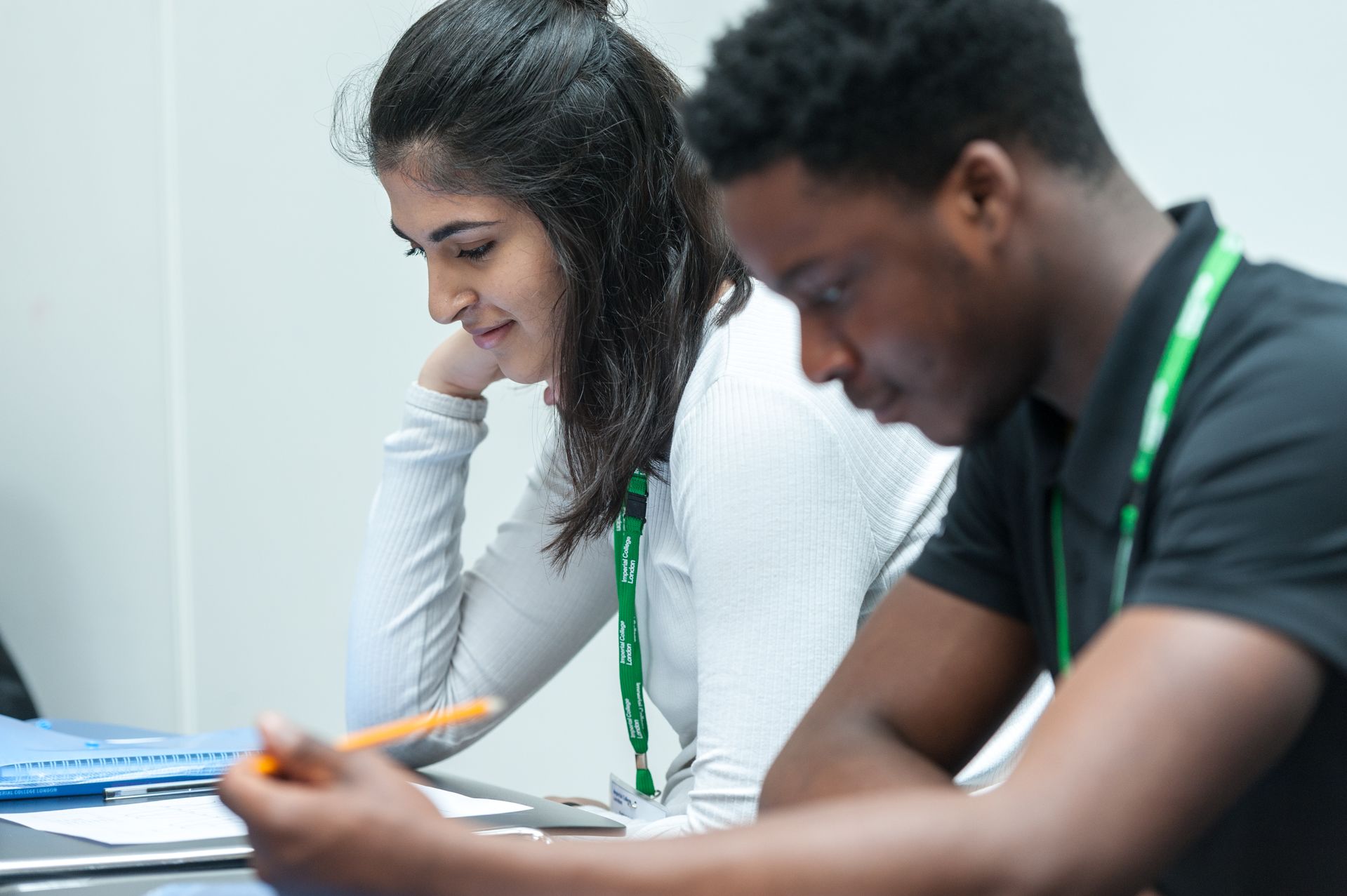 Young man and woman studying together