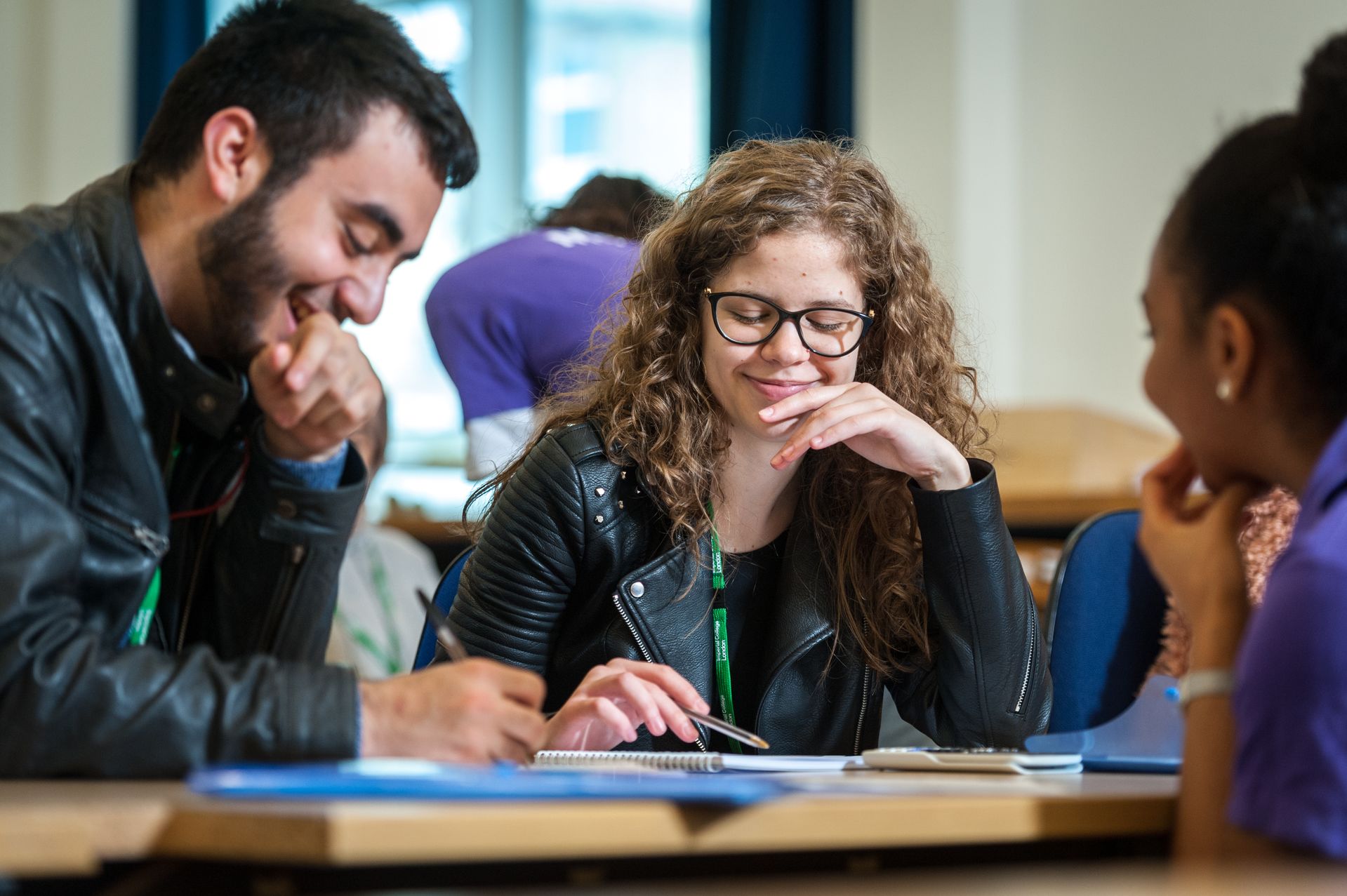 Young woman and man studying together